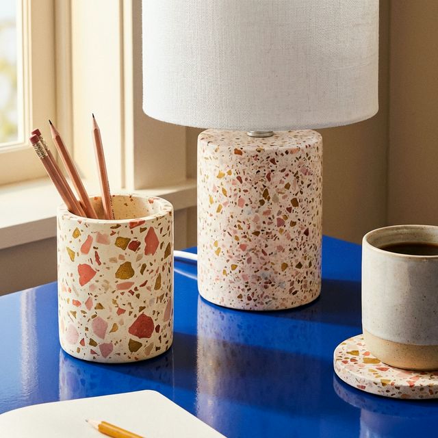 Terrazzo desk accessories on cobalt blue desk