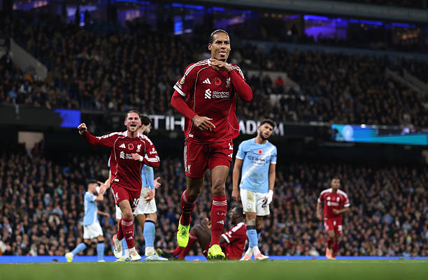 Virgil van Dijk of Liverpool celebrates scoring a goal which is later disallowed following a VAR review for offside during the Premier League match...