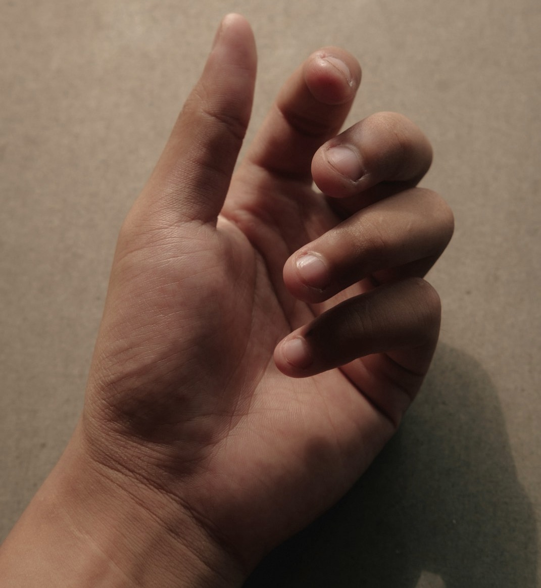 a person's hand with a thumb up