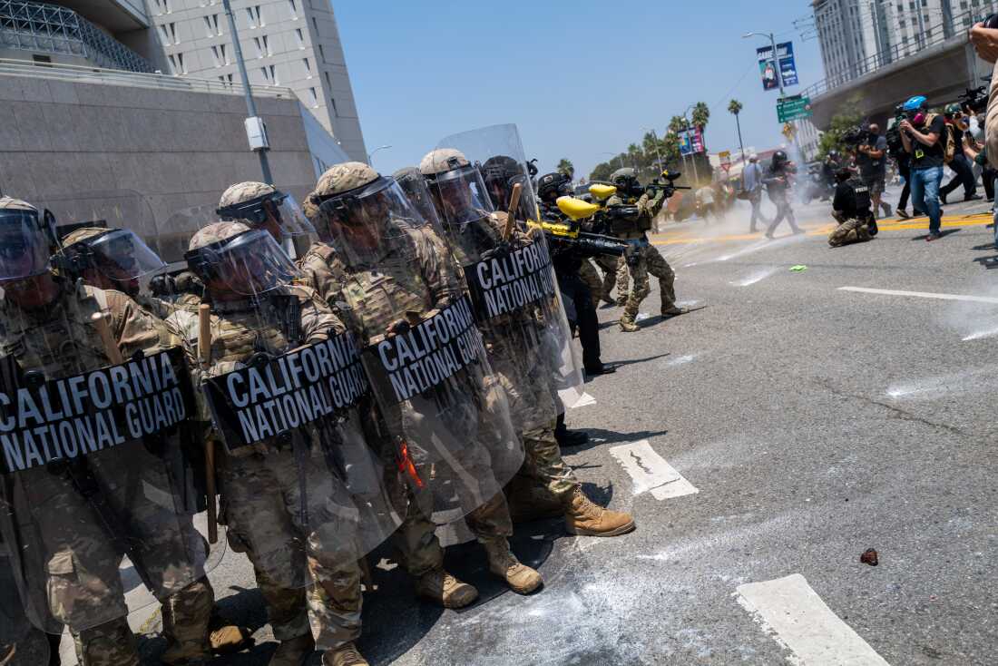 The National Guard, police and protesters stand off outside of a downtown jail in Los Angeles on Sunday following days of clashes with law enforcement over immigration raids.