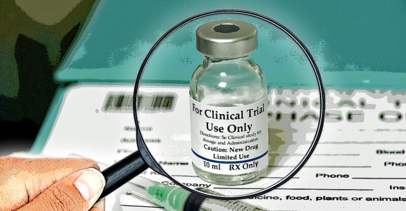 magnifying glass over a covid vaccine bottle "for clinical trial use only" magnifying glass over a covid vaccine bottle "for clinical trial use only"