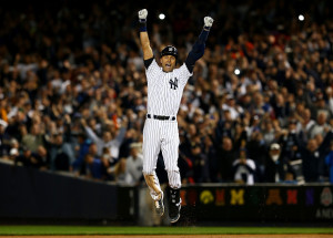 NEW YORK, NY - SEPTEMBER 25: Derek Jeter #2 of the New York Yankees celebrates after a game winning RBI hit in the ninth inning against the Baltimore Orioles in his last game ever at Yankee Stadium on September 25, 2014 in the Bronx borough of New York City. (Photo by Elsa/Getty Images)
