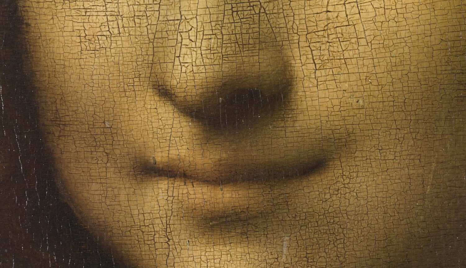 Close-up of the Mona Lisa's subtle smile and cracked paint surface