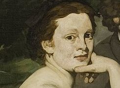 Close-up of the seated woman looking directly out of Luncheon on the Grass