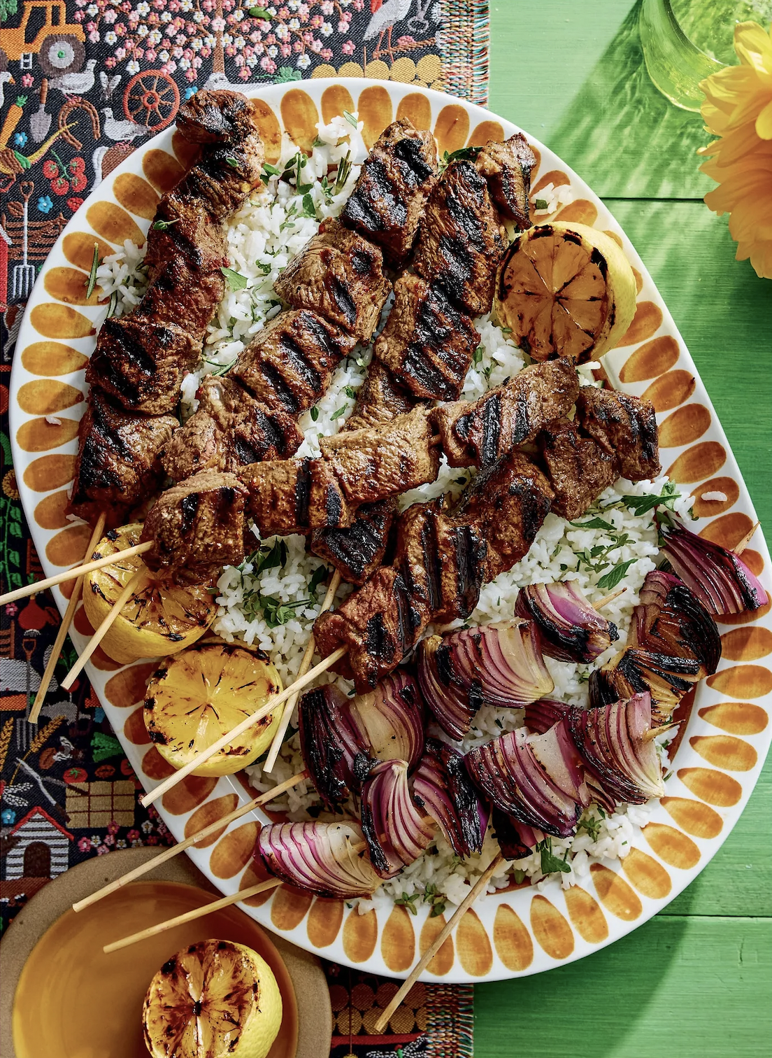 marinated steak tips over herby rice