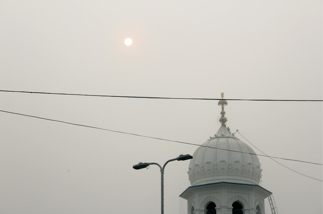 The sun sets over Nankana Sahib