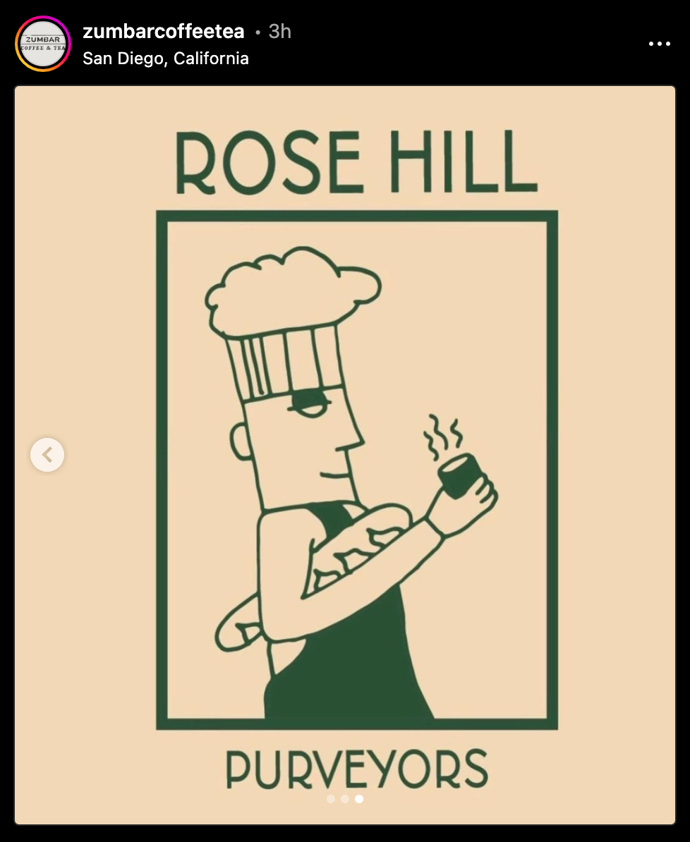 An illustrated chef holding a coffee and loaf of french bread, in profile.
