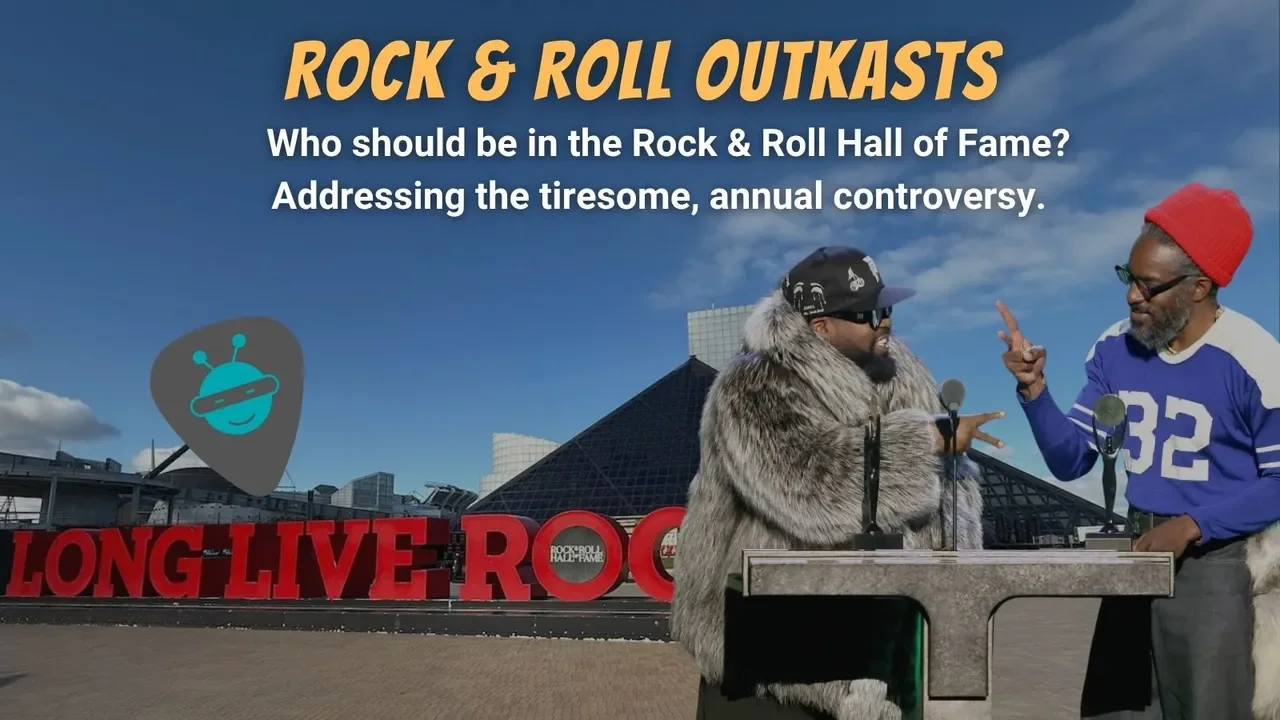 Picture of the Rock & Roll Hall of fame with Outkast in the foreground accepting their induction.