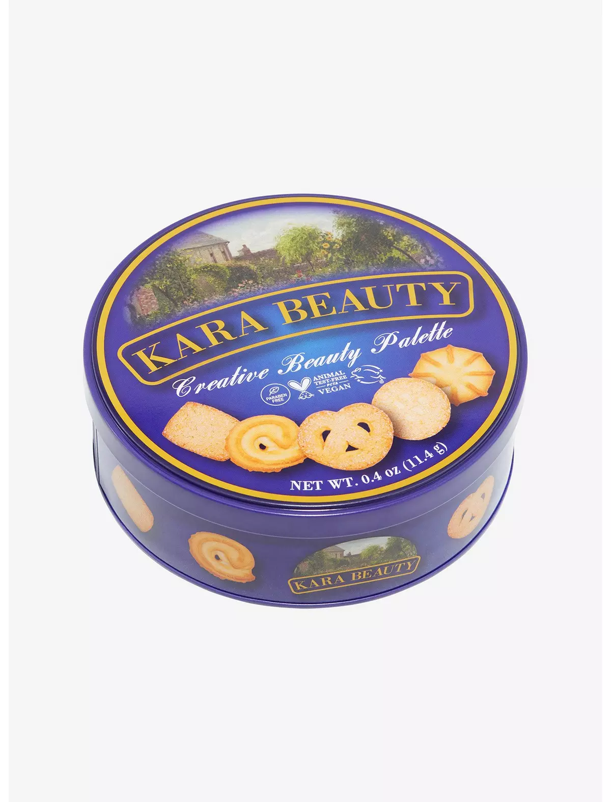 A blue tin of what looks like Danish cookies that everyone’s grandmother stored buttons and sewing supplies in. It shows butter cookies on the top but instead of the usual brand logo, it says Kara Beauty: Creative Beauty Palette.”