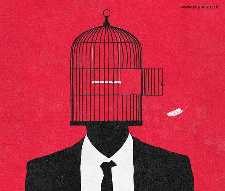 This may contain: a man in a suit with a bird cage on his head This may contain: a man in a suit with a bird cage on his head