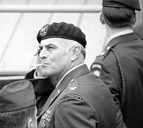 A person in military uniform smoking a cigarette

AI-generated content may be incorrect.