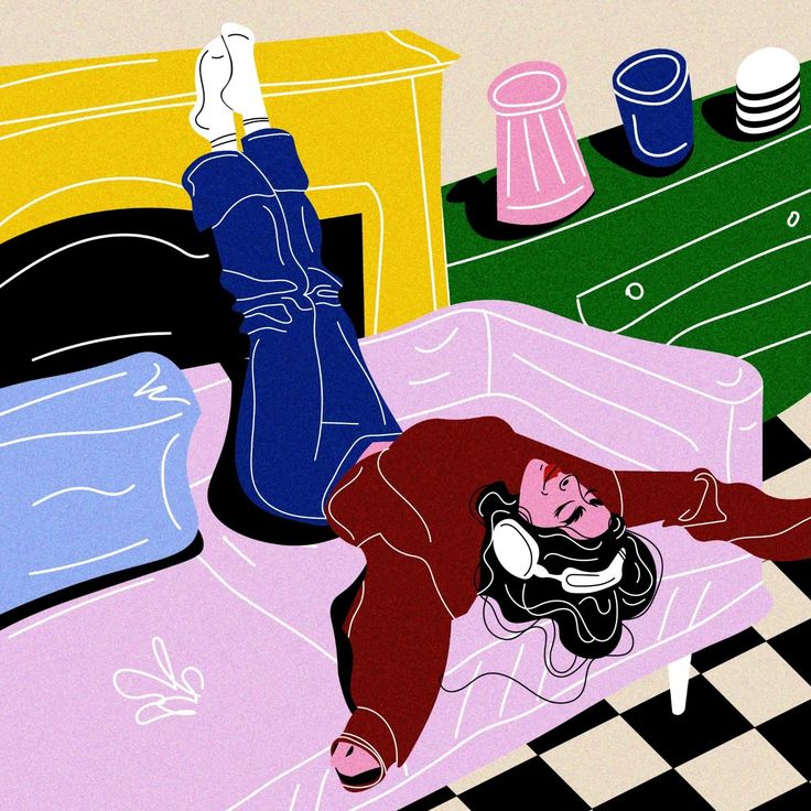 This may contain: a woman laying on top of a bed in a room with checkered flooring