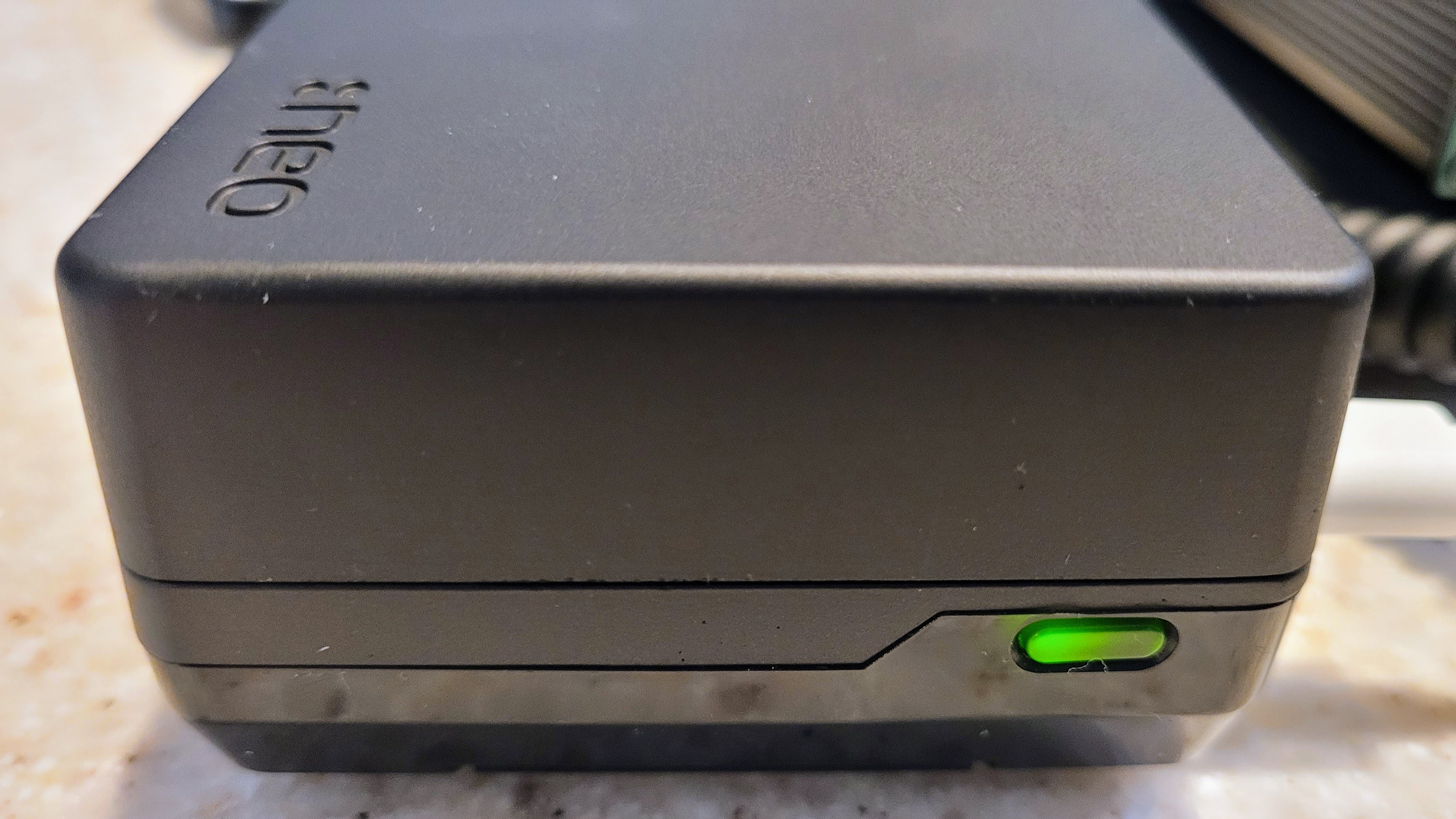 The power button glows green when the system is running