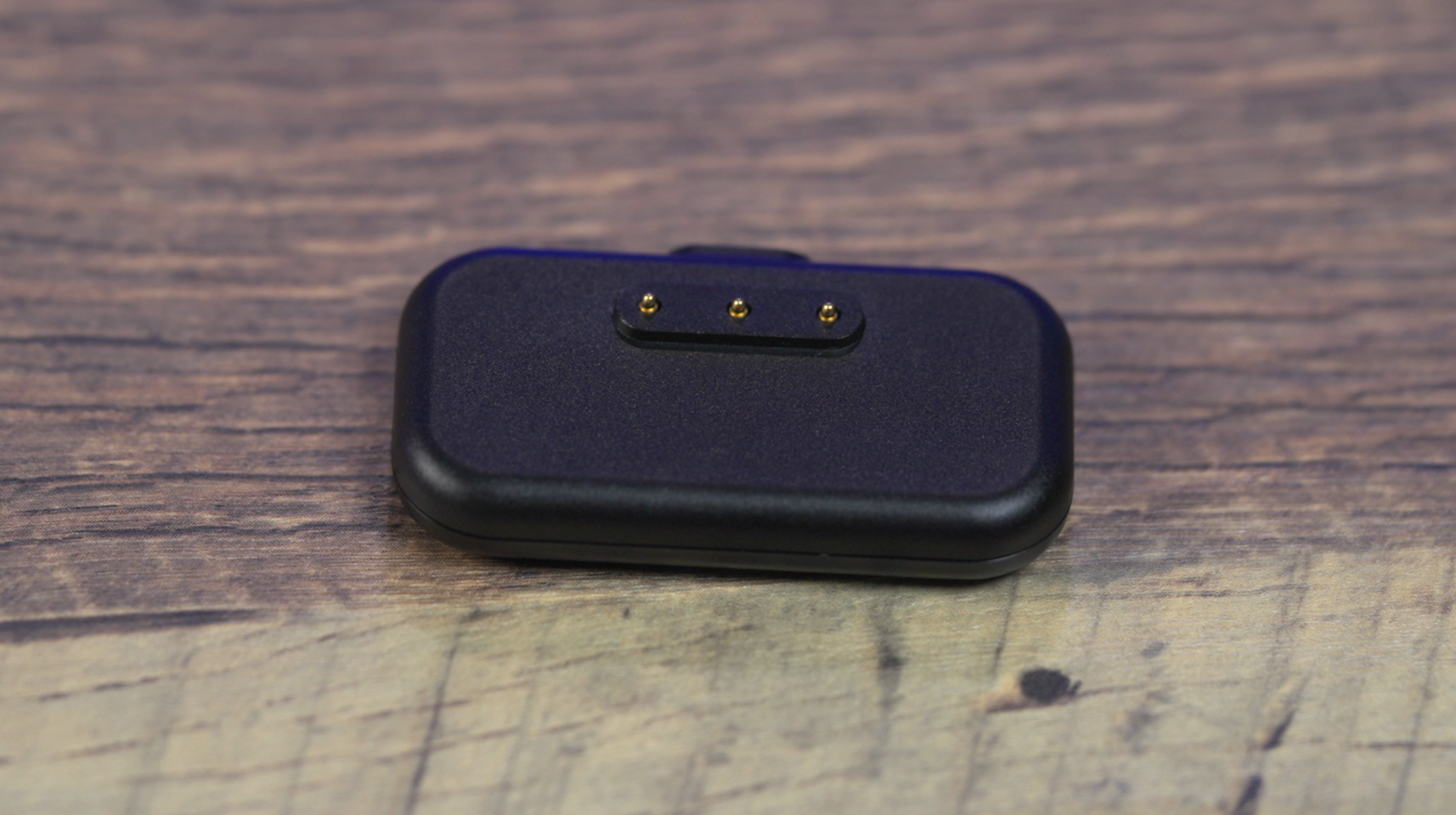 Steam Controller 2026 with charging puck — the magnetic puck attaches to the back of the controller for wireless connectivity and charging