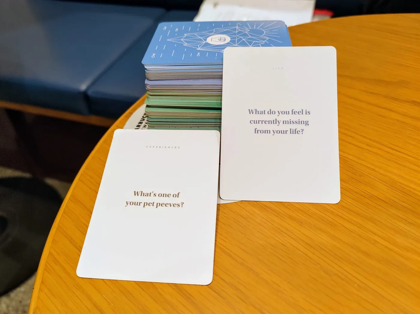 Question cards on a table at Curious Souls Cafe