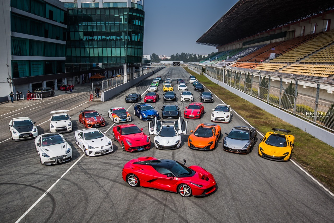 Group of colorful supercars lined up on a racetrack, representing speed parity and the fading advantage of technical performance.