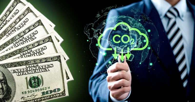 man holding co2 with down arrow and money on top man holding co2 with down arrow and money on top