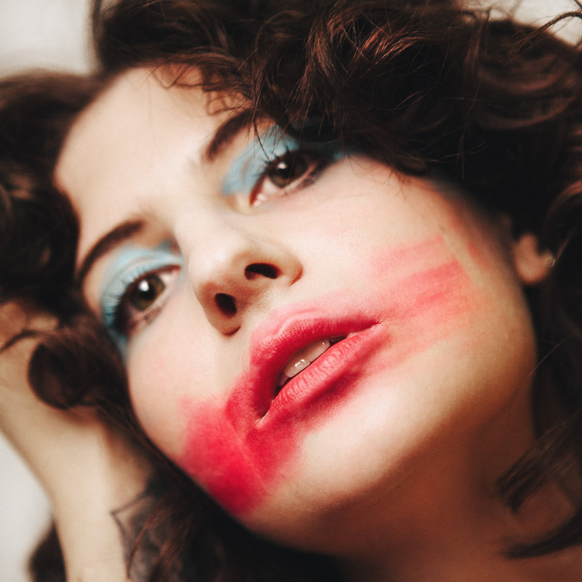 sam bielanski of pony with red lipstick that's smeared across their face