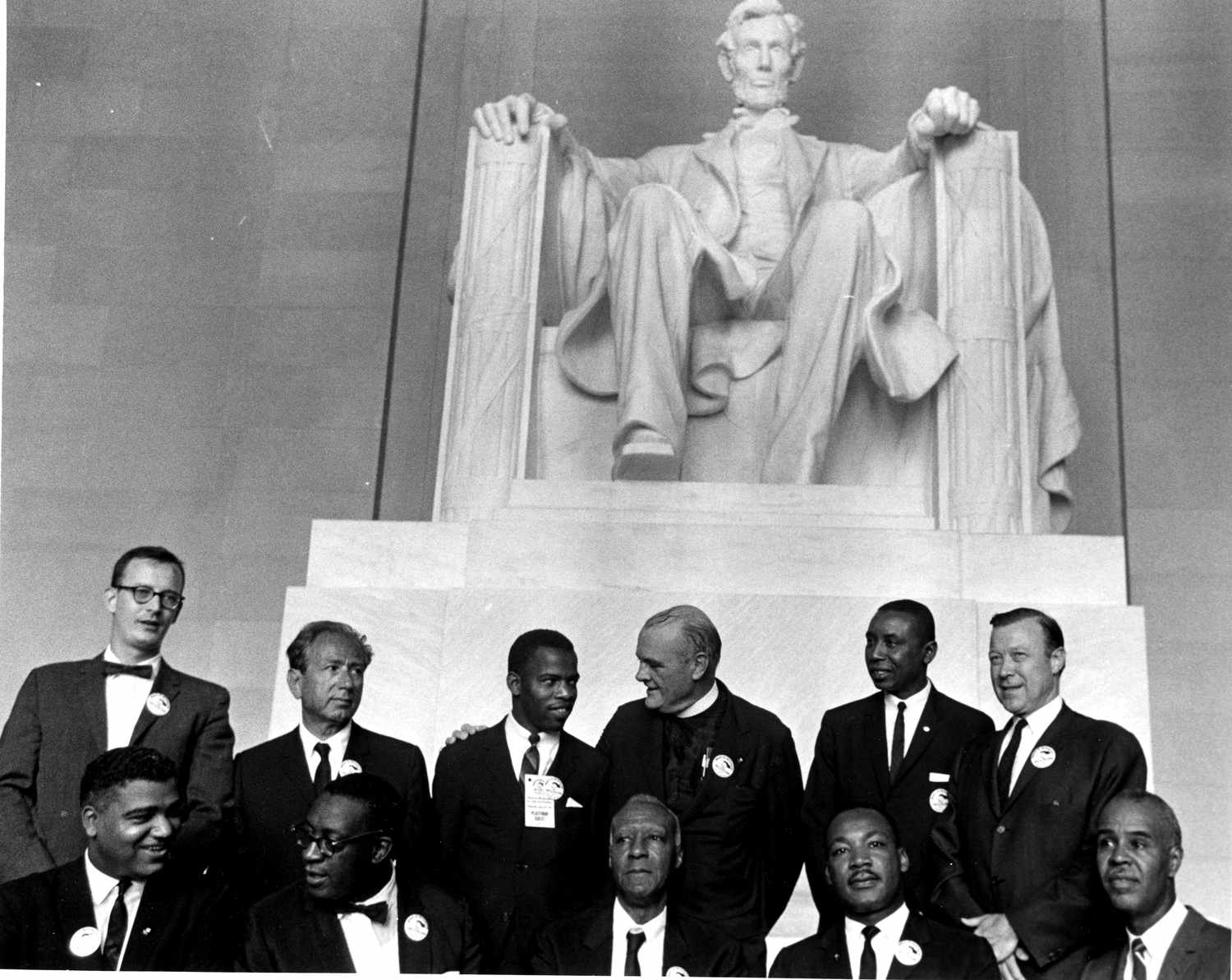 Civil rights leaders and government officials meet at the Lincoln Memorial, symbolizing the interaction between a revolutionary movement and authorities