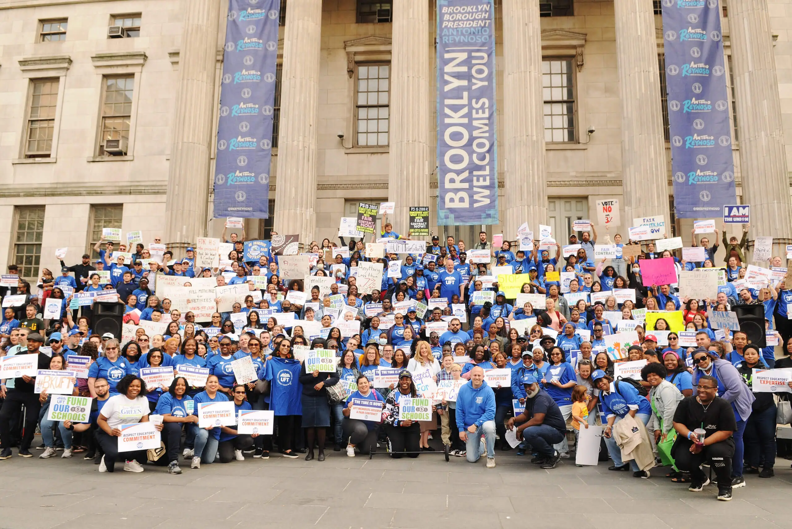 Hundreds of UFT members holding signs demanding a fair contract in front of the Brooklyn Borough Hall building. Hundreds of UFT members holding signs demanding a fair contract in front of the Brooklyn Borough Hall building.