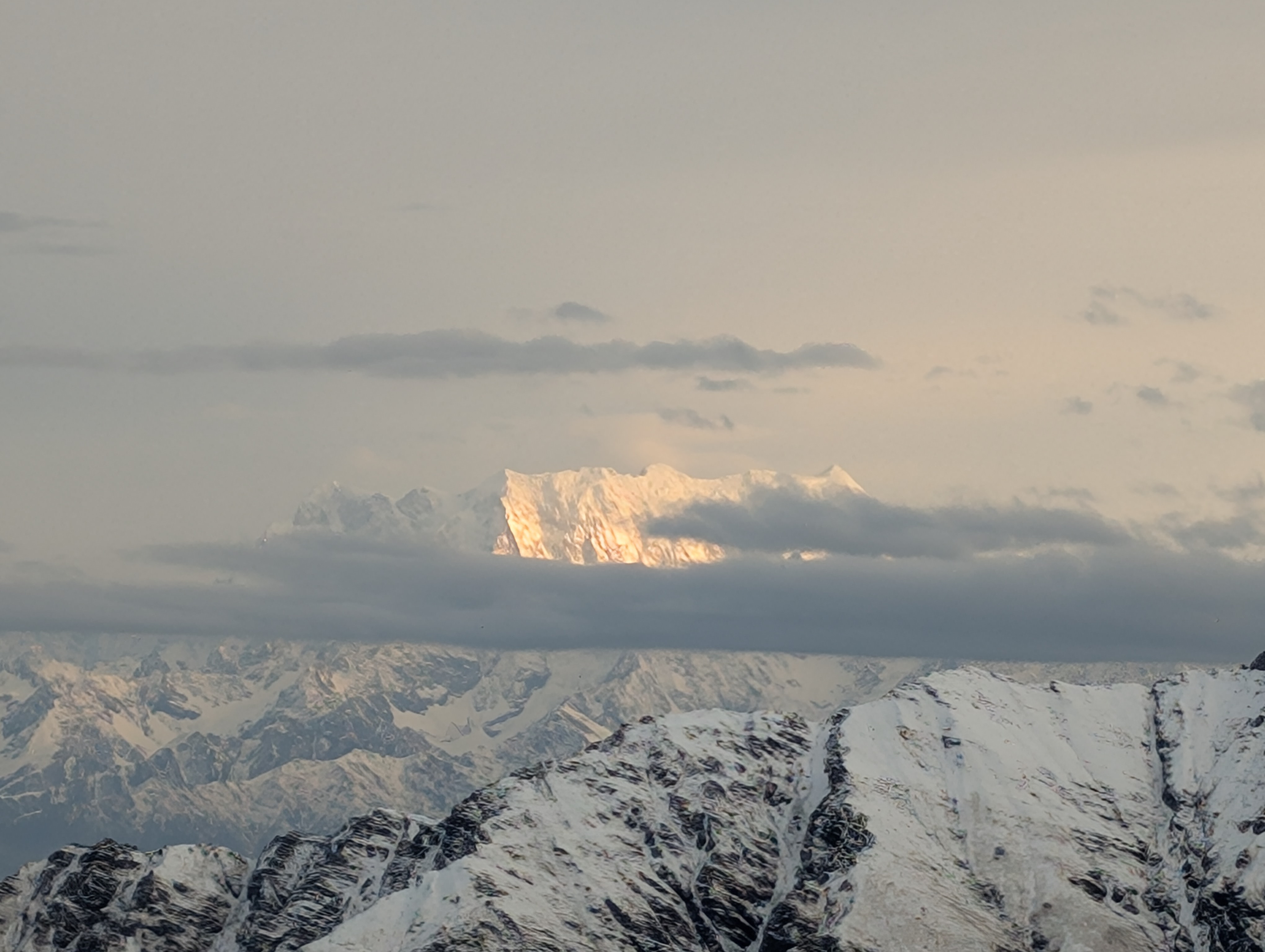Snow fields with Trishul and Nanda Ghunti in view on Devyani's Roopkund summit push