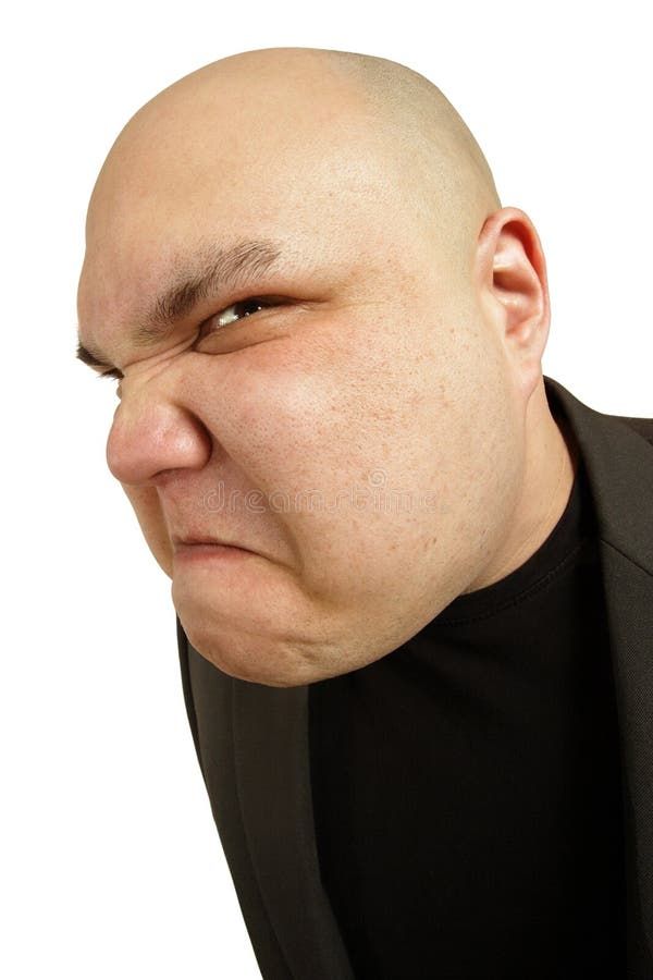 Angry sneer - a bald man with an angry threatening sneer on his face