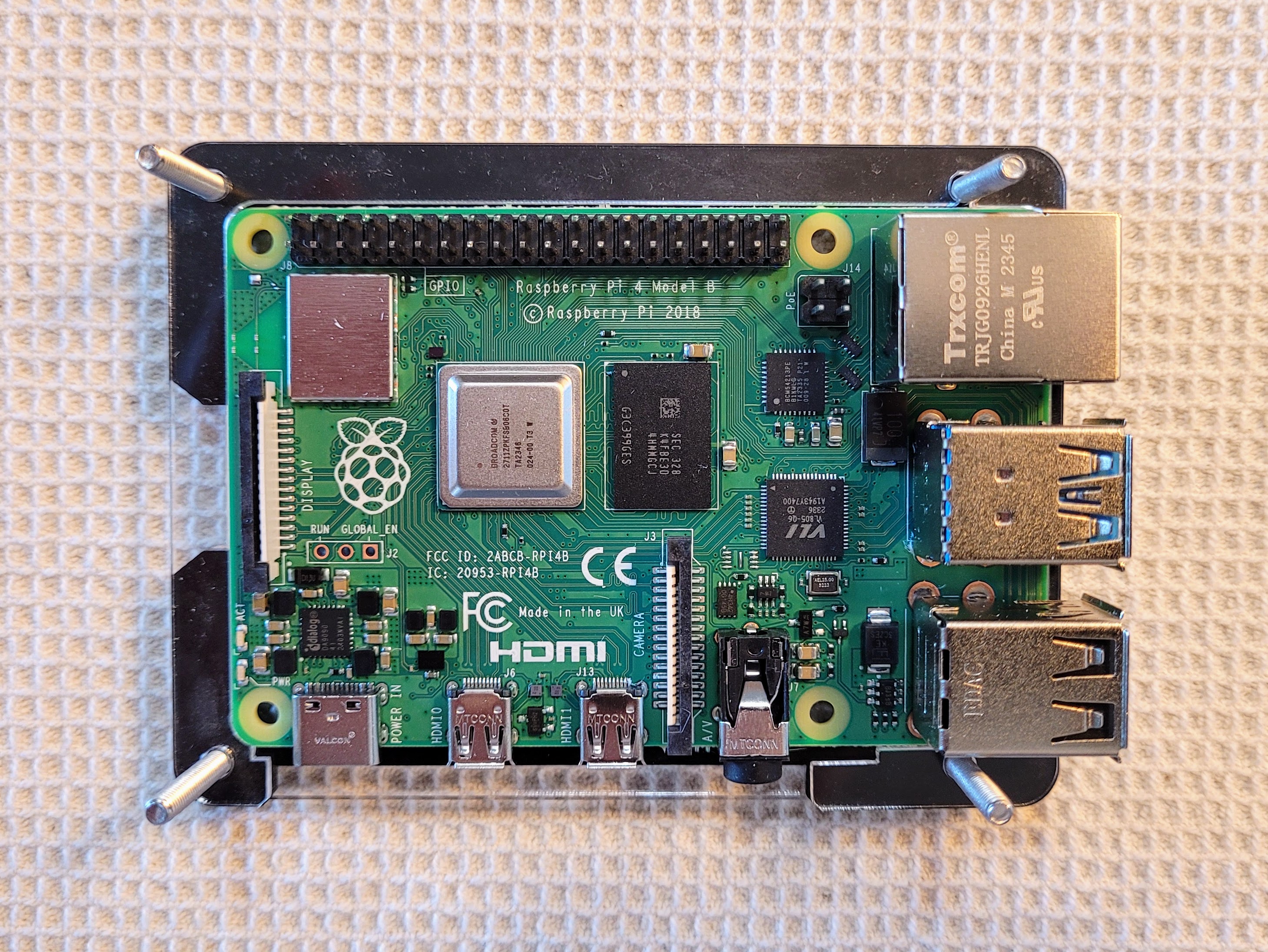 Raspberry Pi 4 nestled into position in the clear layer