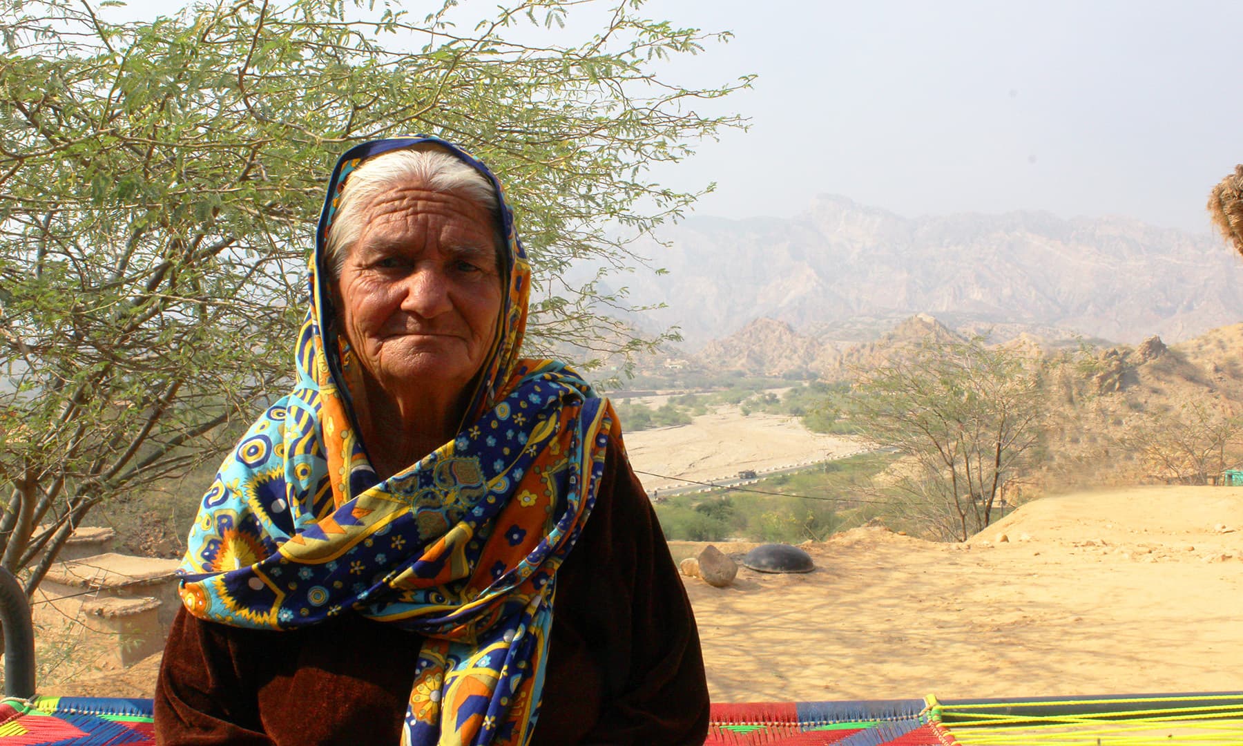 Khayal Marjana sits in her courtyard. — Photo by author