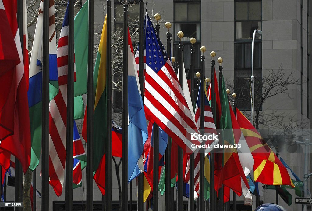 Line of flags from all different countries and nations The American flag stands out among others from around the world on display at Rockefeller Center in Manhattan Diplomacy Stock Photo Line of flags from all different countries and nations The American flag stands out among others from around the world on display at Rockefeller Center in Manhattan Diplomacy Stock Photo