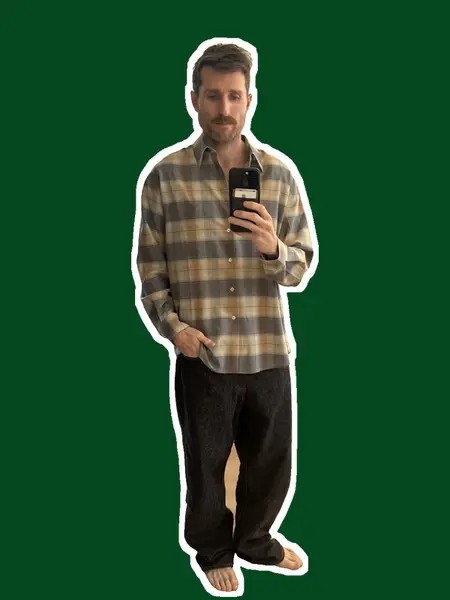 Brian wearing his long-sleeve plaid Auralee tropical wool shirt