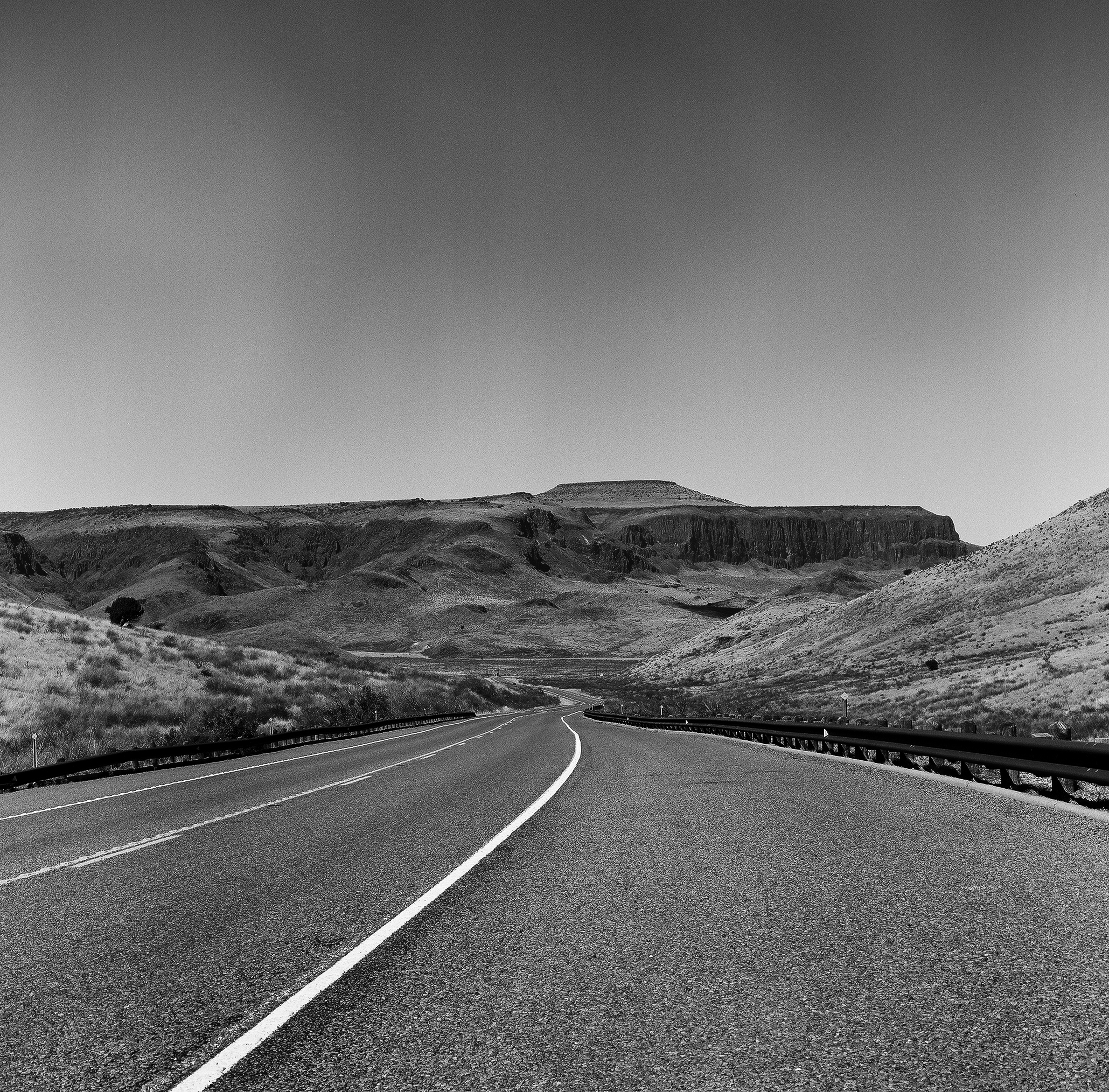 Long and winding road through mountains.