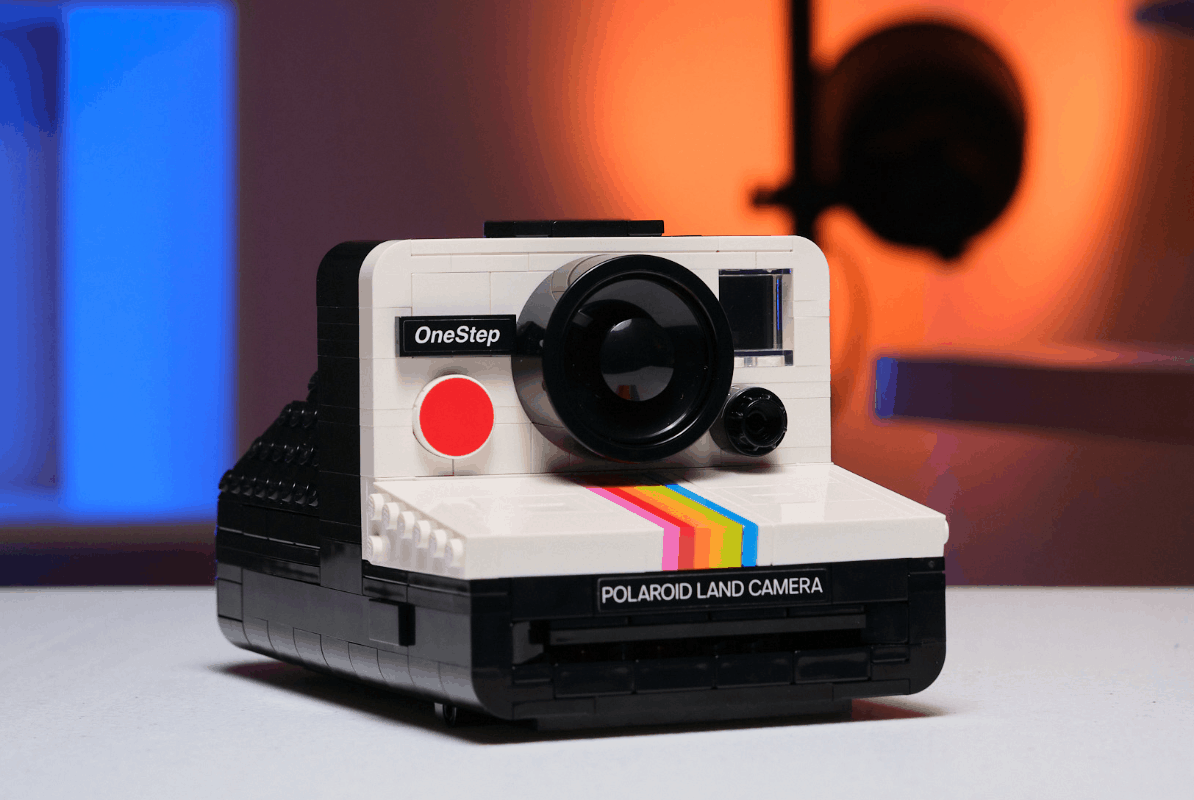 Here's a GIF we made that flips back and forth between the Lego Polaroid and the one that takes film