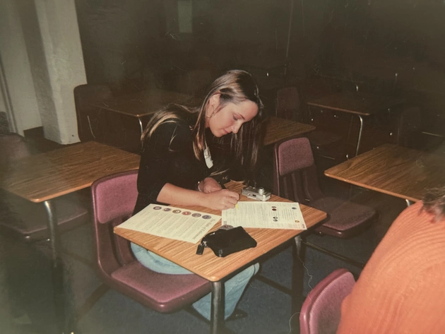 Courtney Williams signs documents.