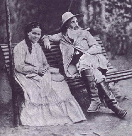 Historic photograph of a bearded man and a woman seated on a bench
