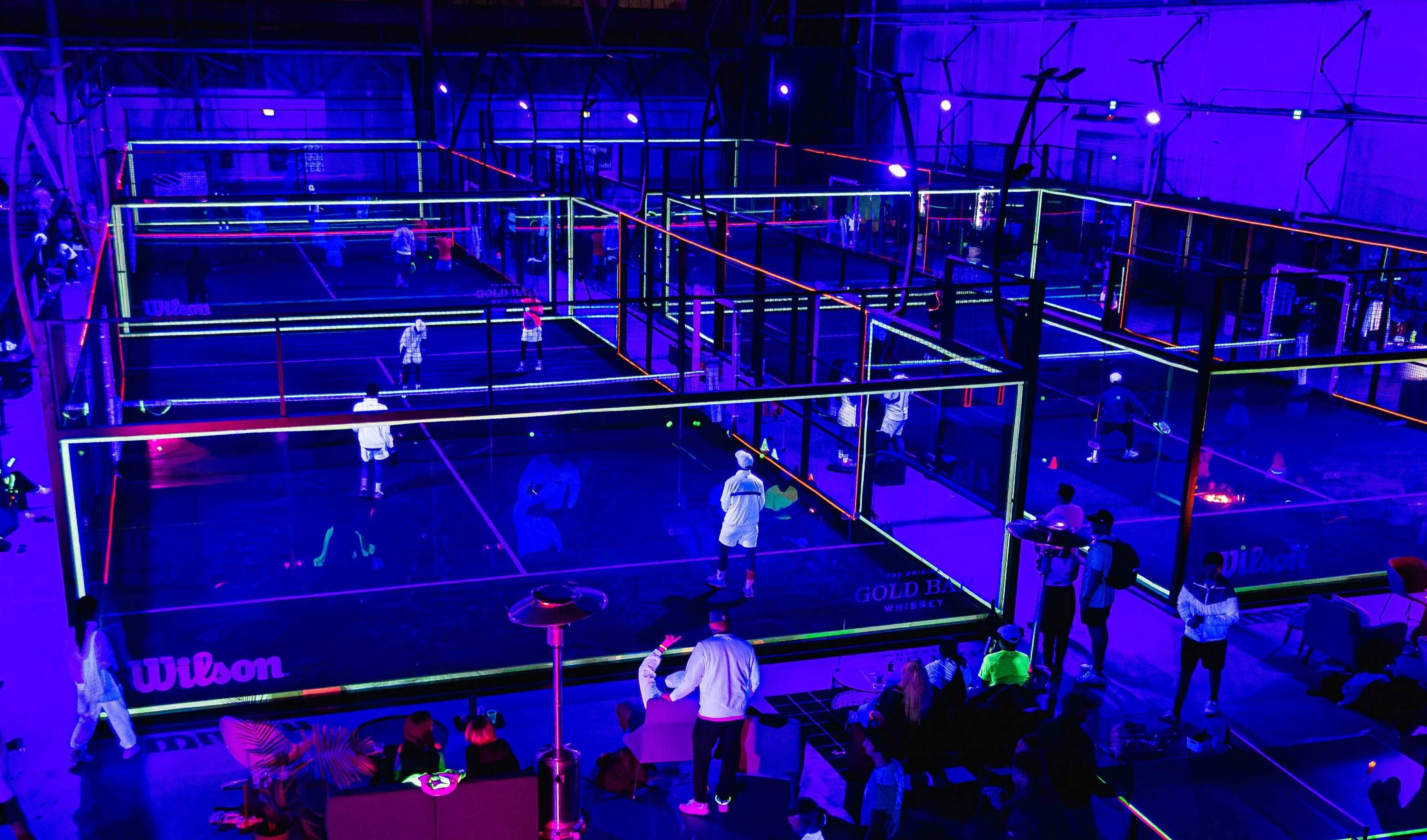 Glow in the dark party on padel courts at Bay Padel in San Francisco