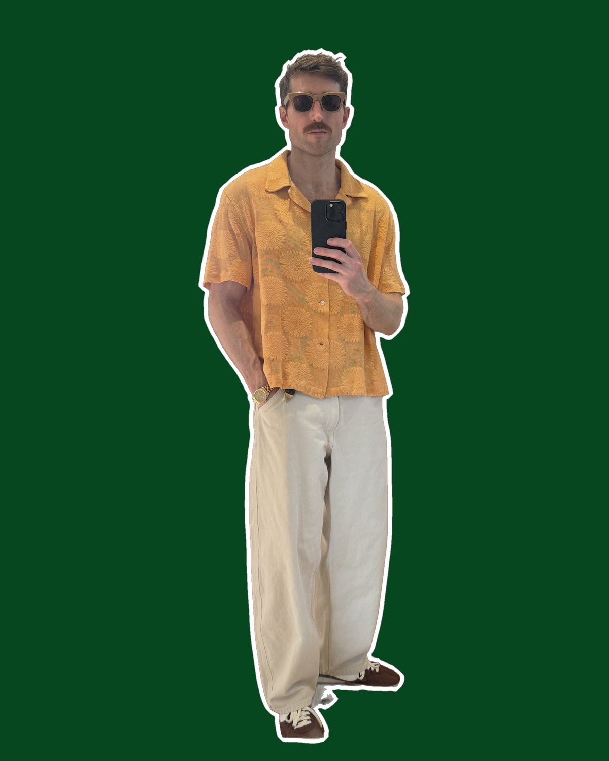 Brian Ellingwood wearing white Uniqlo U barrel pants with an orange short-sleeve shirt