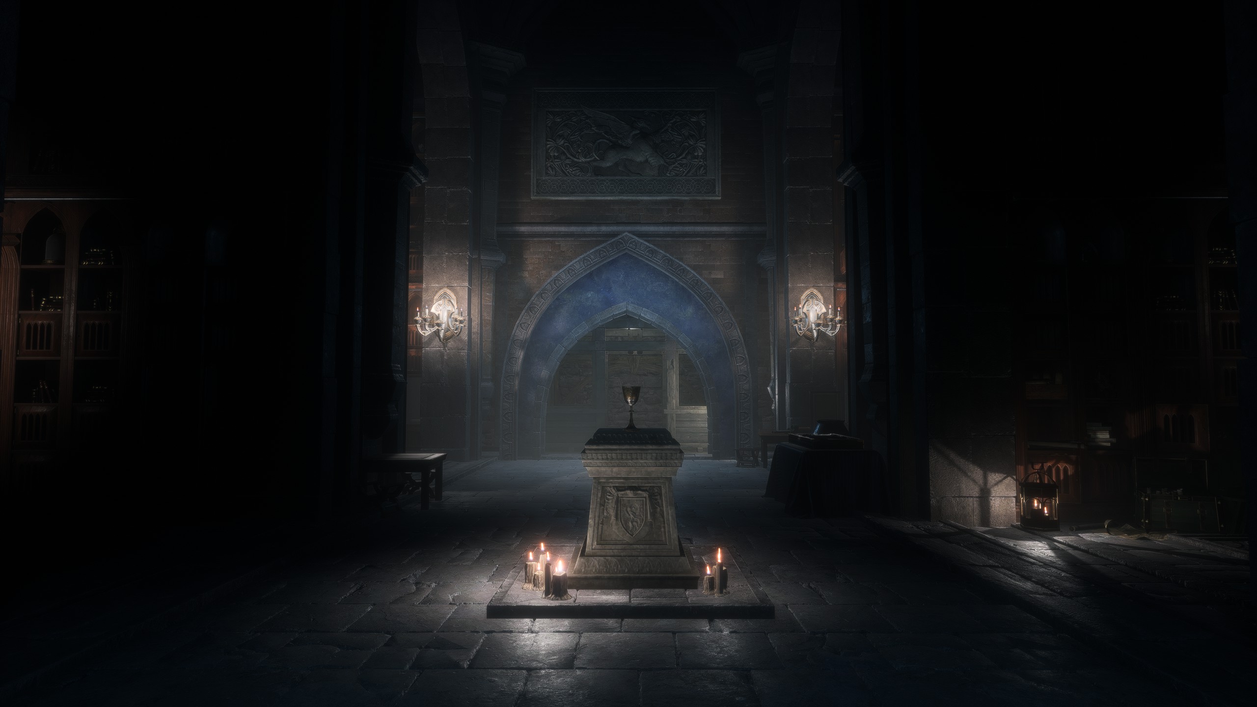 A screenshot from Dragon Age: The Veilguard of a dark, candlelit chamber. A silver chalice sits atop a stone pedestal in the center of the room. Beyond it lies an open archway.