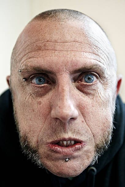 Close up skinhead male looking aggressive - angry man face