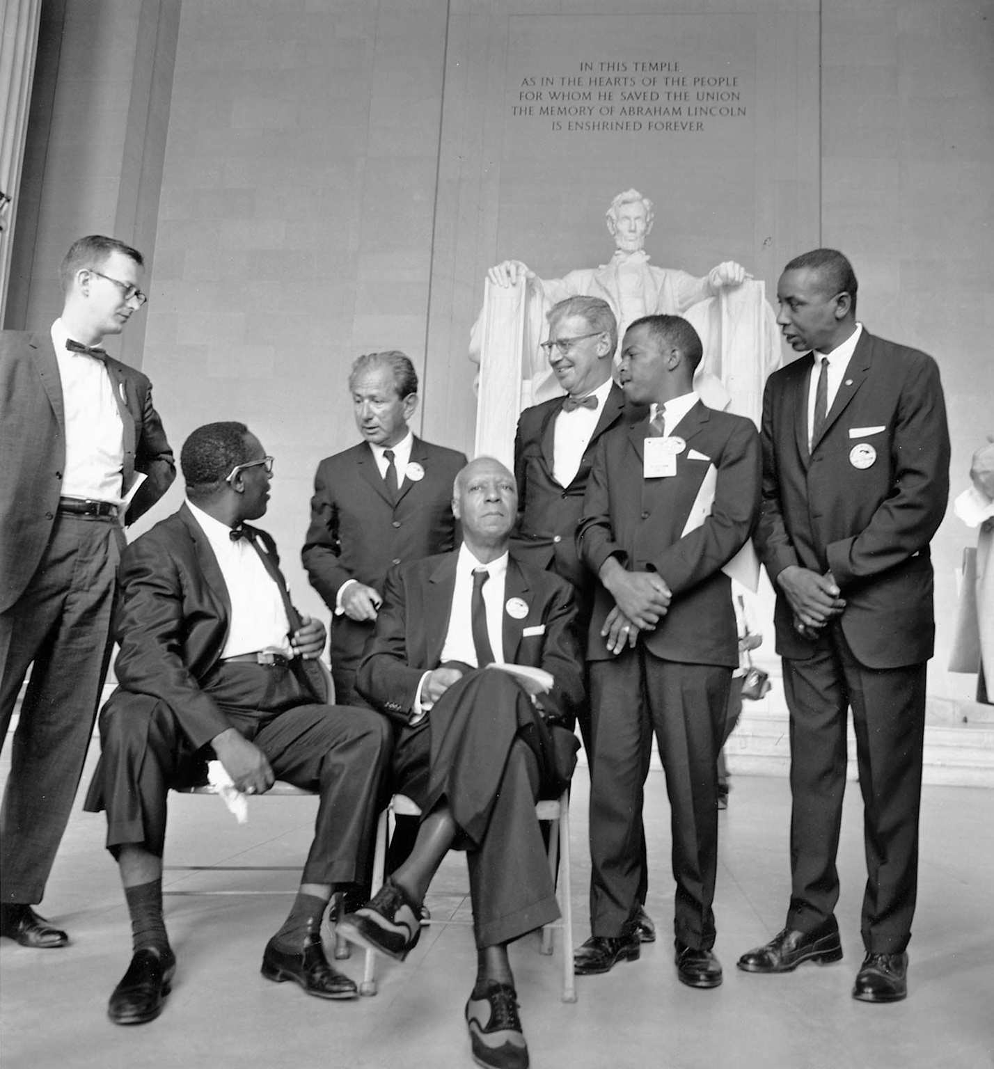Civil rights leaders and government officials meet at the Lincoln Memorial, symbolizing dialogue between revolutionary movements and authorities in the 1960s