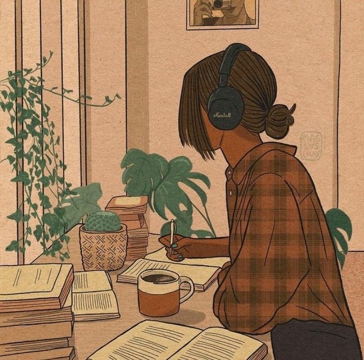 This may contain: a woman sitting at a table with books and headphones on, reading a book