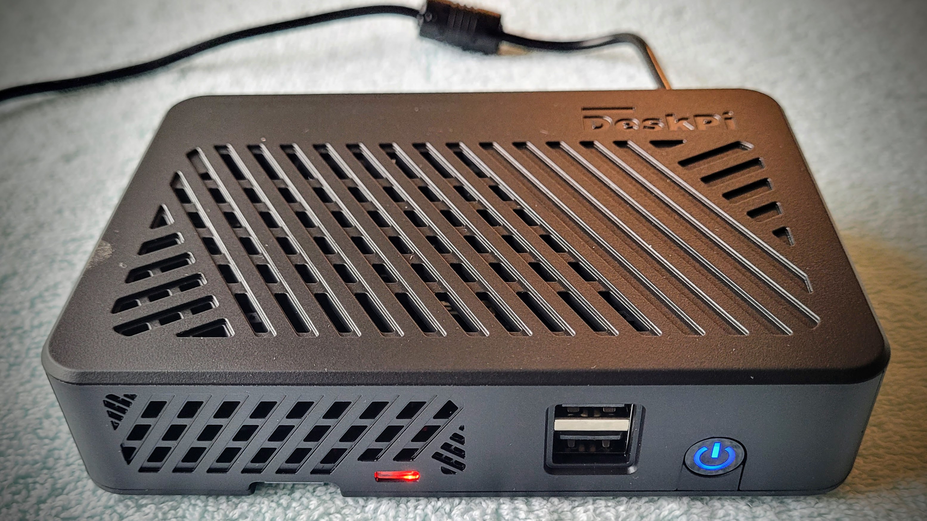 DeskPi Lite with a Raspberry Pi 4 single board computer installed and running