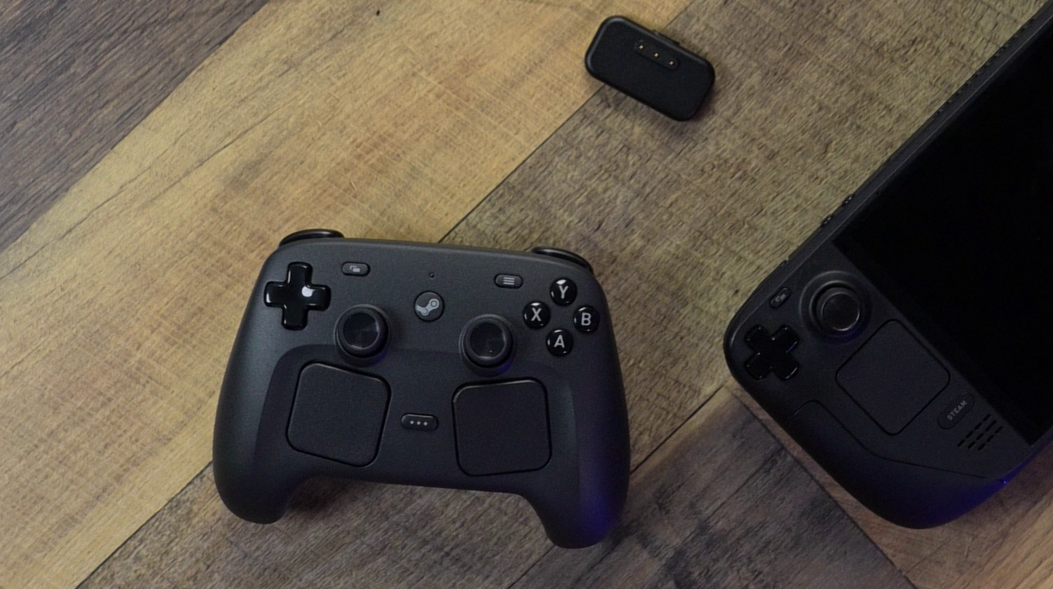 Close-up detail of the Steam Controller 2026 haptic trackpads showing the capacitive touch surface and Force Touch-style pressure sensitivity
