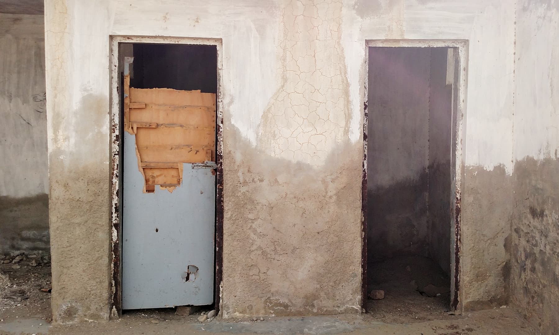 Wooden doors of the hostel rooms are in dilipidated condition. — Bilal Karim Mughal